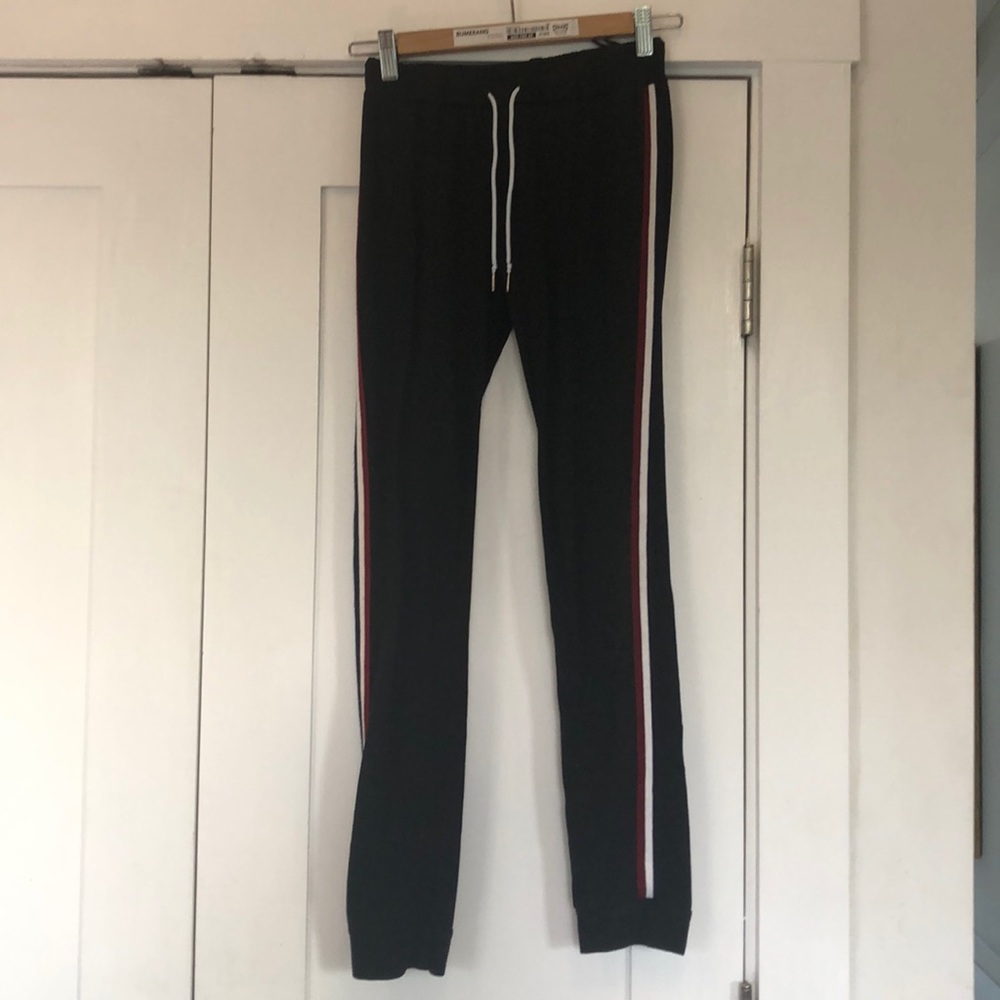 Black leggings with a red, white, and blue stripe